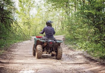 ATV on a muddy dirt trail