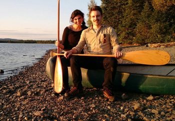 Couple with a canoe near the lake
